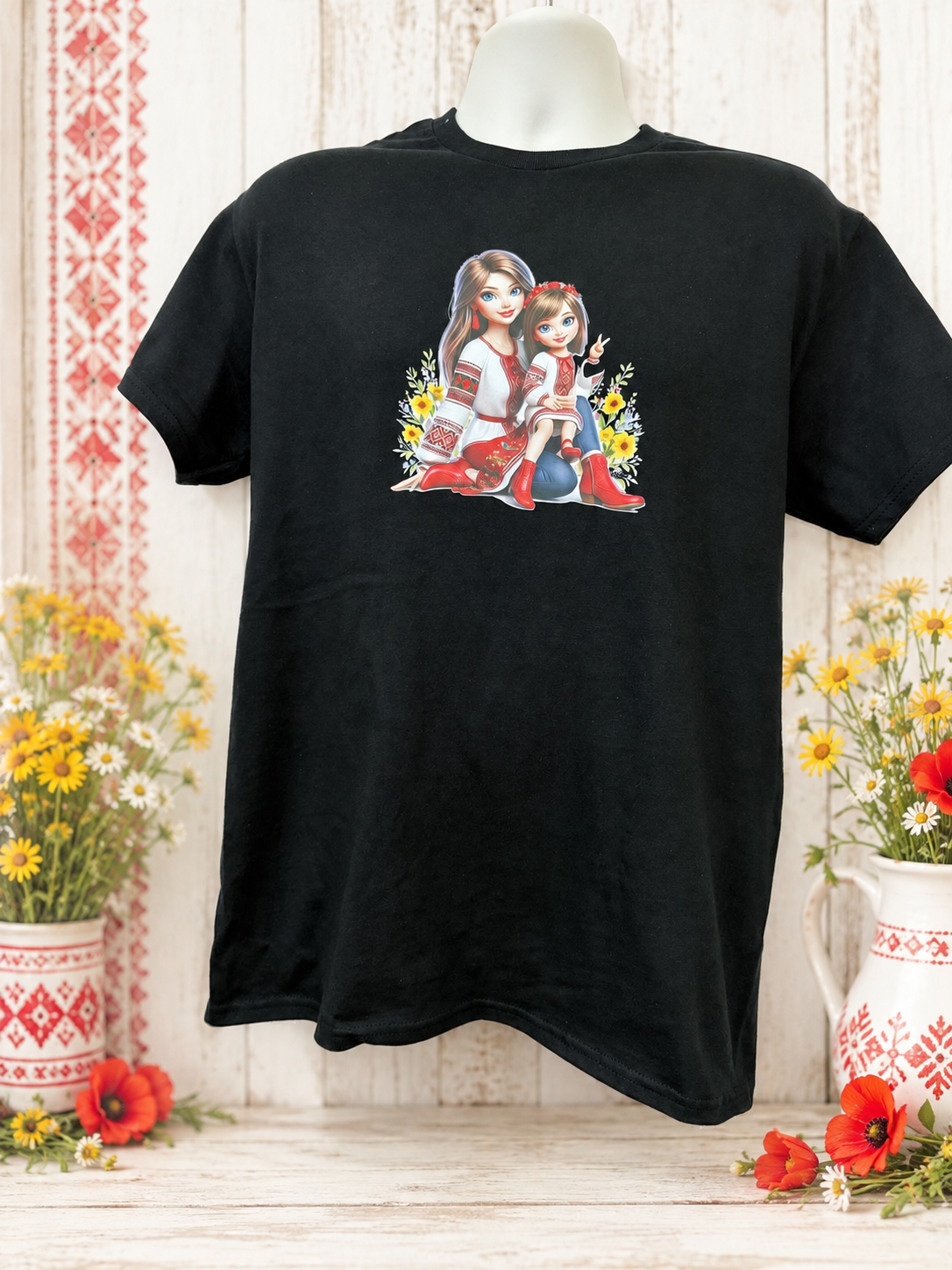 Custom Graphic T-Shirt- featuring a design of a mother with her daughter standing by her legs; both are wearing red shoes.